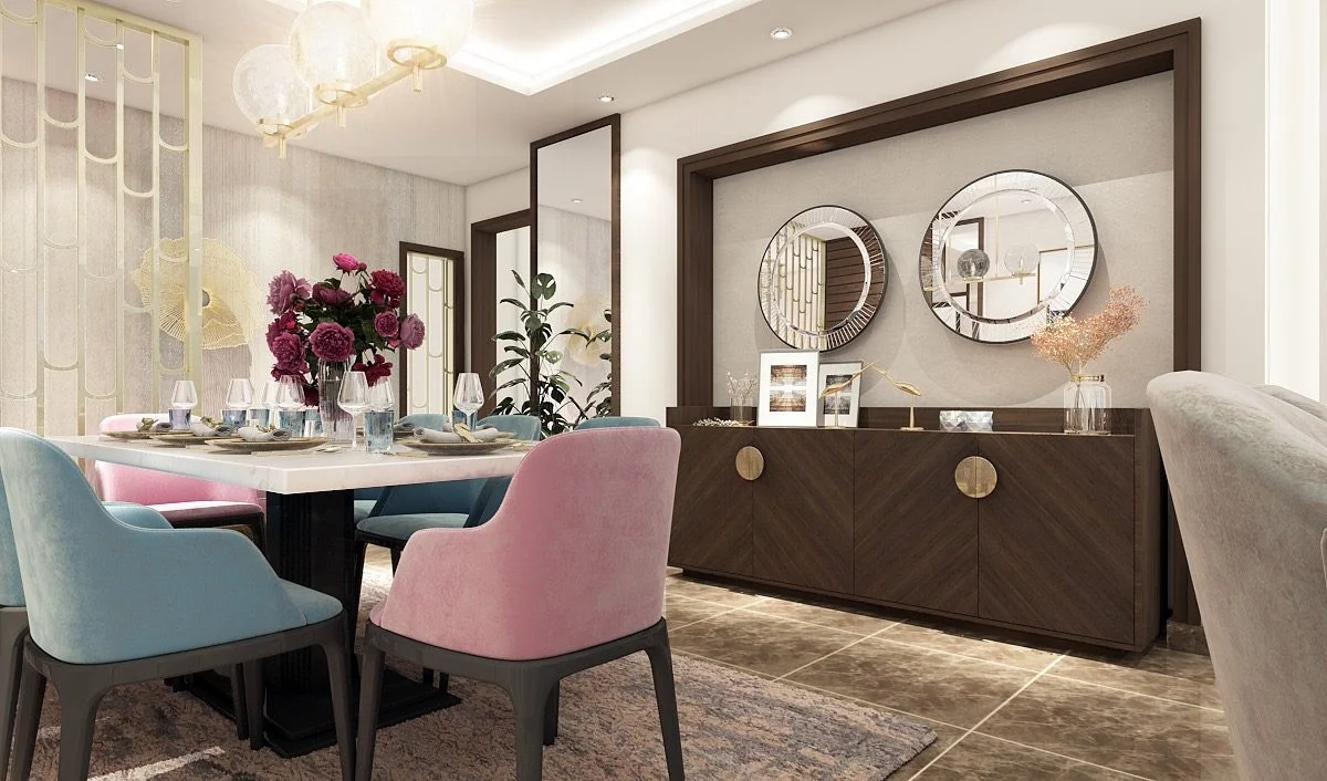 Dining room with pink and blue velvet chairs, round mirrors and a wooden sideboard